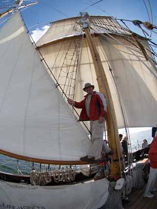 Training Officer Ogilvie, hamming it up on the staysail boom